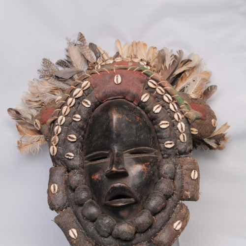 Dan mask, cowry shells and feathers, Ivory Coast